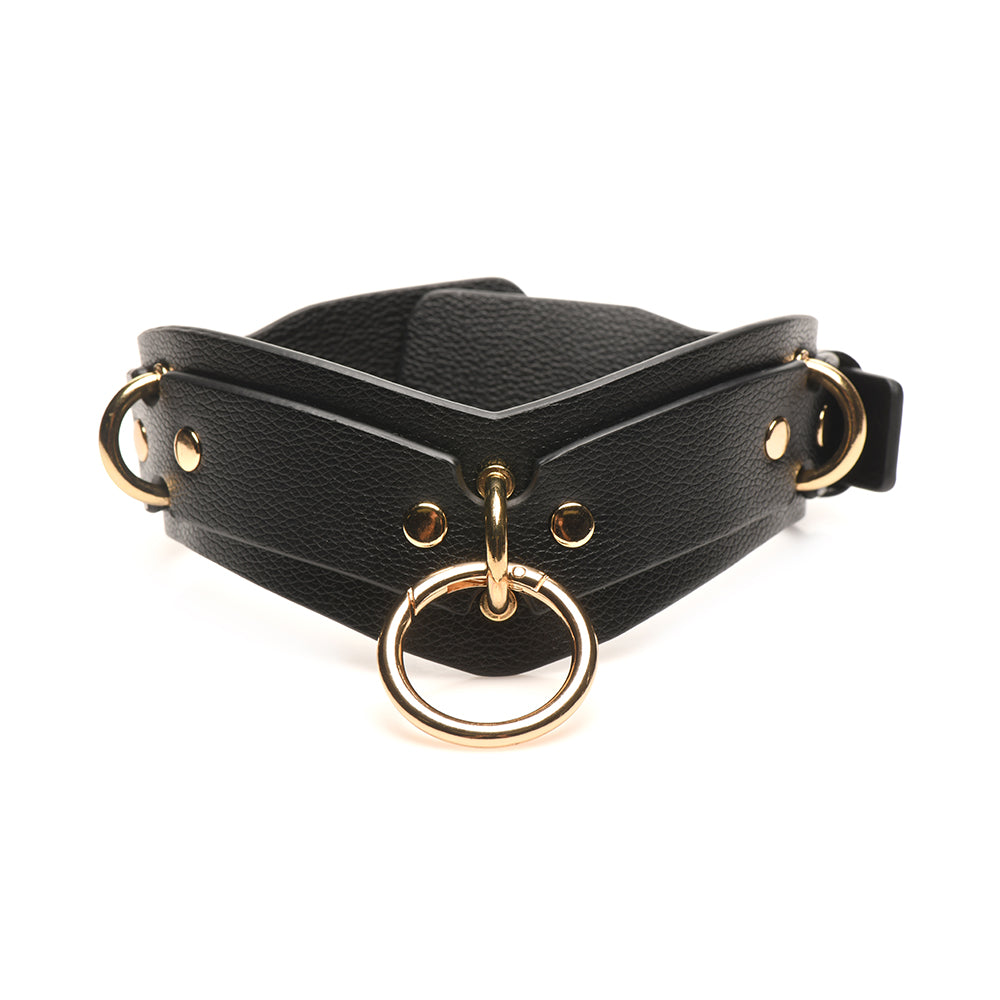Adjustable black vegan leather collar with gold details and a metal ring for attachment in the Bedroom Bliss Lover's Restraints Set.