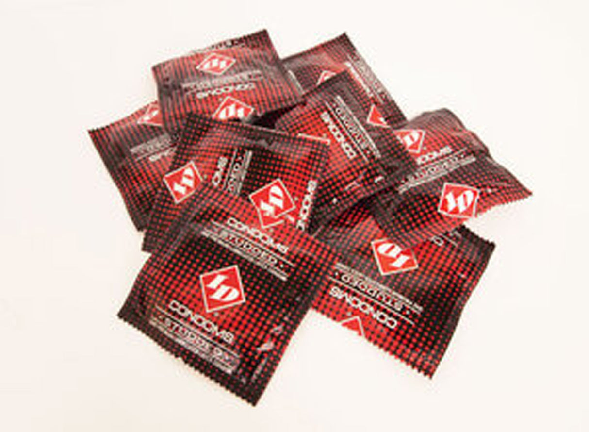 ID Studded Condoms 144 Count Bag displayed in a dynamic pile, showcasing vibrant foil packaging.