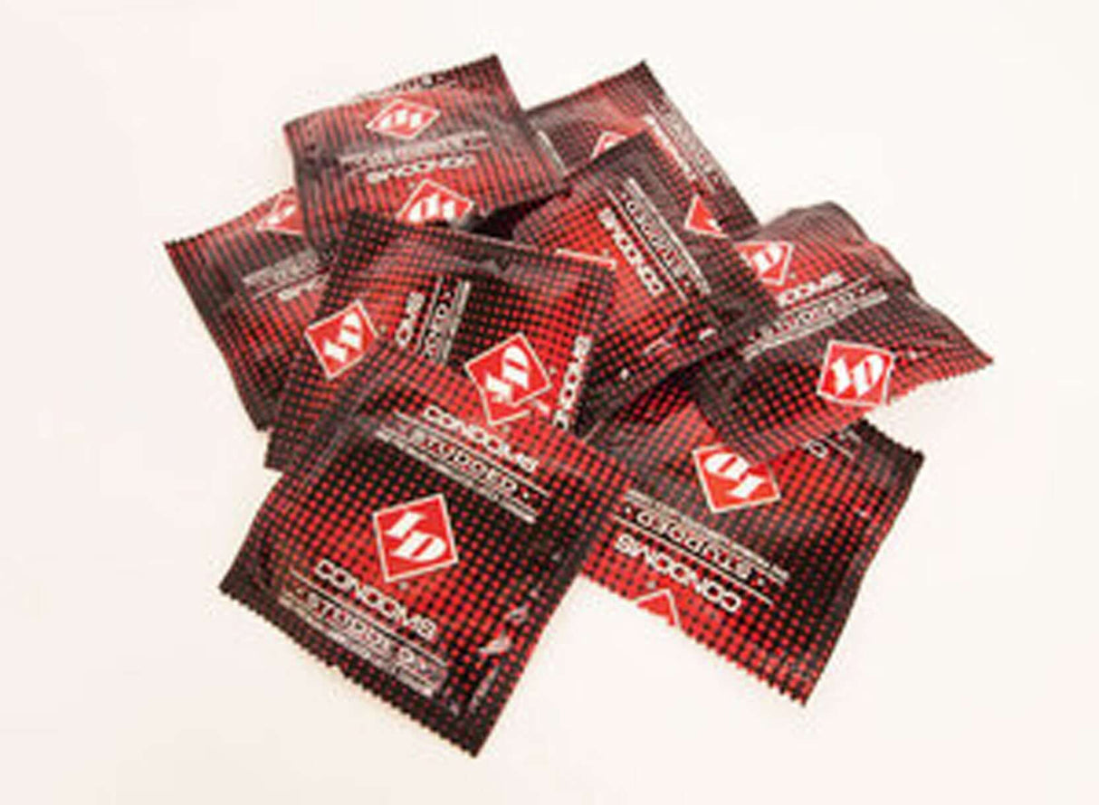 ID Studded Condoms 144 Count Bag displayed in a dynamic pile, showcasing vibrant foil packaging.