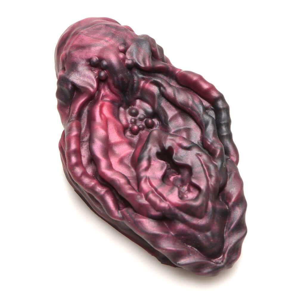 Creature Cocks Xeno Pussy Vulva silicone grinder in red and black with textured design for pleasure enhancement.
