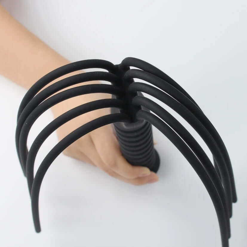 Close-up of Fun-Mates Silea Silicone Whip Flogger, showcasing its easy grip handle and flexible silicone strands.