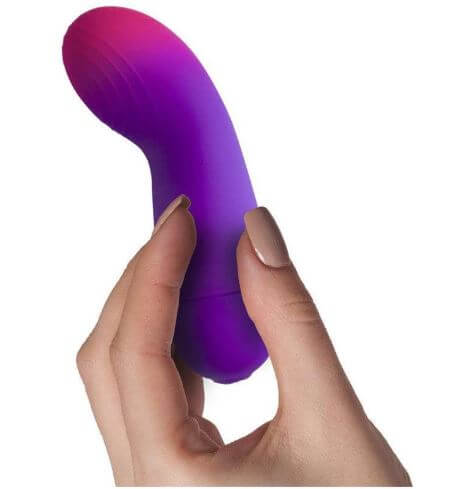 Rock Off Glo-Girl Vibe Pink Purple vibrator held in hand, showcasing its sleek design for G-spot stimulation.