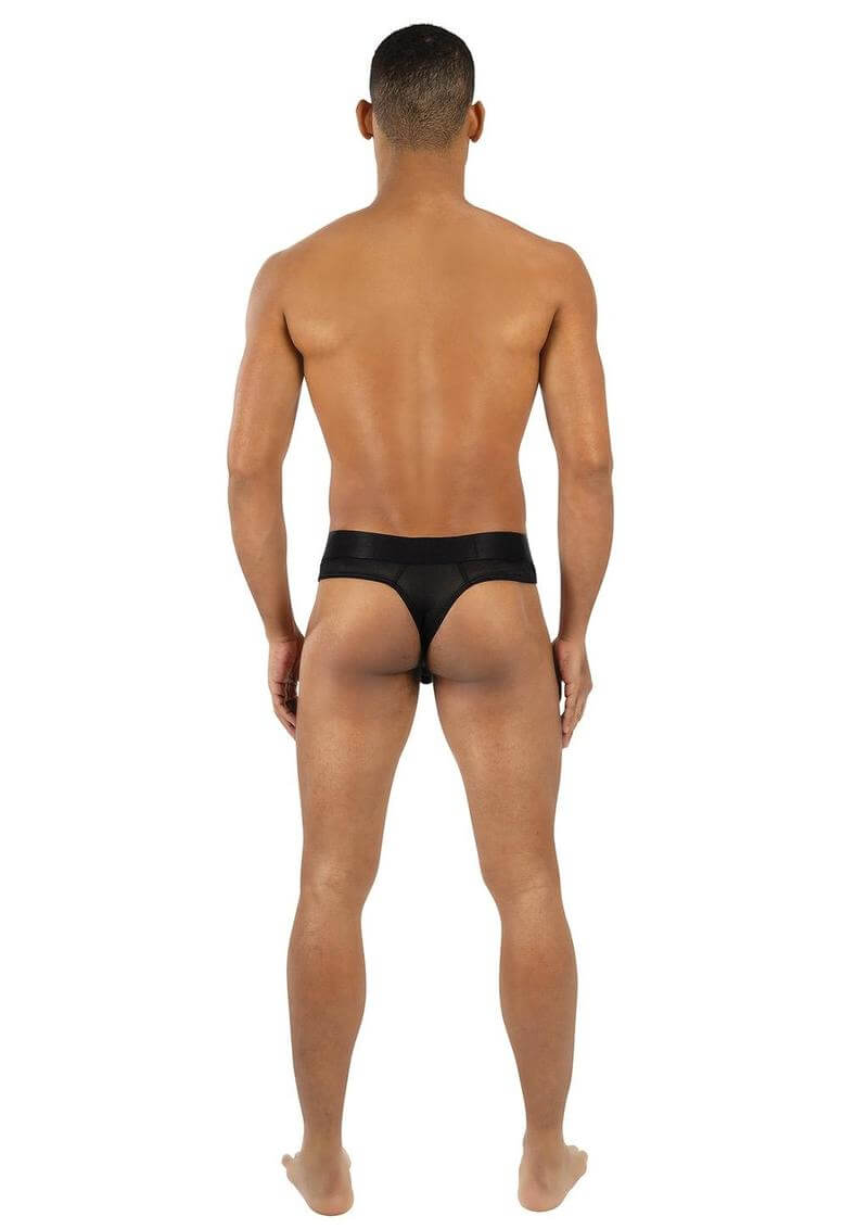 Back view of a model wearing Envy Midnight Athletics Thong Black Medium Large, showcasing the design and comfort.
