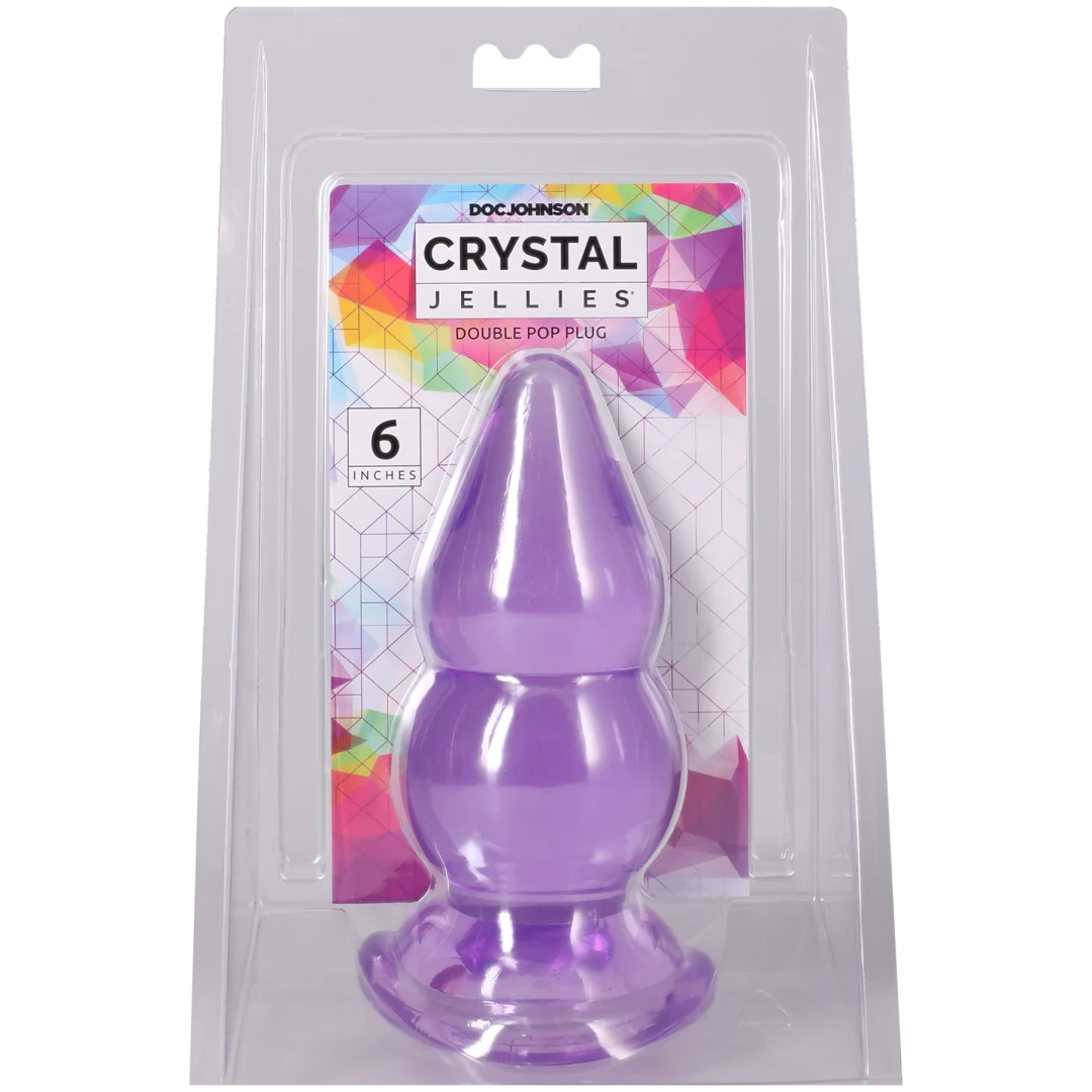 Crystal Jellies Double Pop Plug 6 Inch Purple in packaging, showcasing its double curve design for pleasurable sensations.