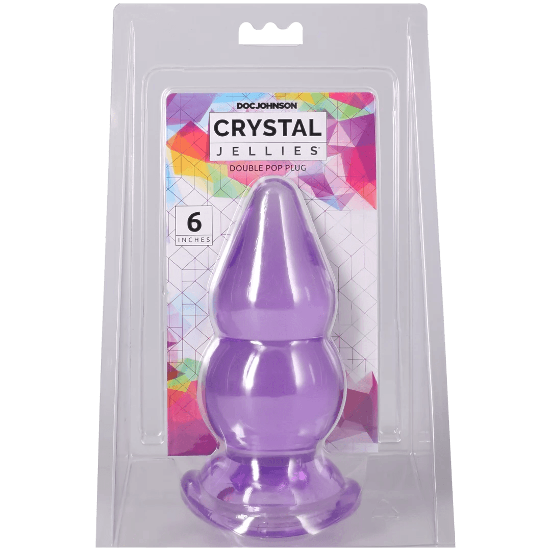 Crystal Jellies Double Pop Plug 6 Inch Purple in packaging, showcasing its double curve design for pleasurable sensations.