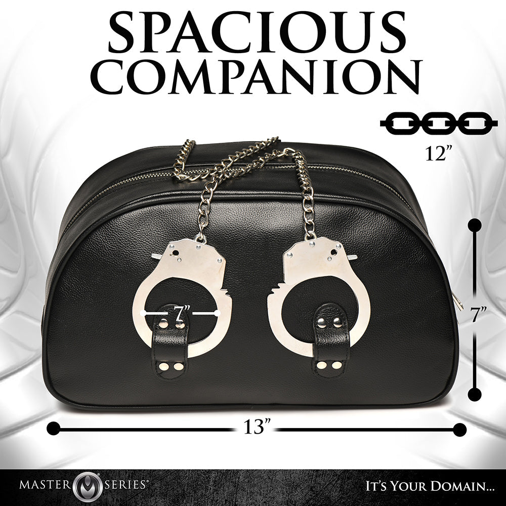 Master Series Cuffed & Loaded Travel Bag with handcuff handles, stylish bondage design, vegan faux leather, spacious and durable.