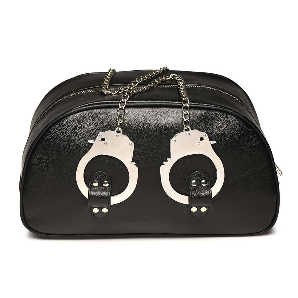 Master Series cuffed travel bag with handcuff handles in black faux leather, perfect for stylish bondage essentials.