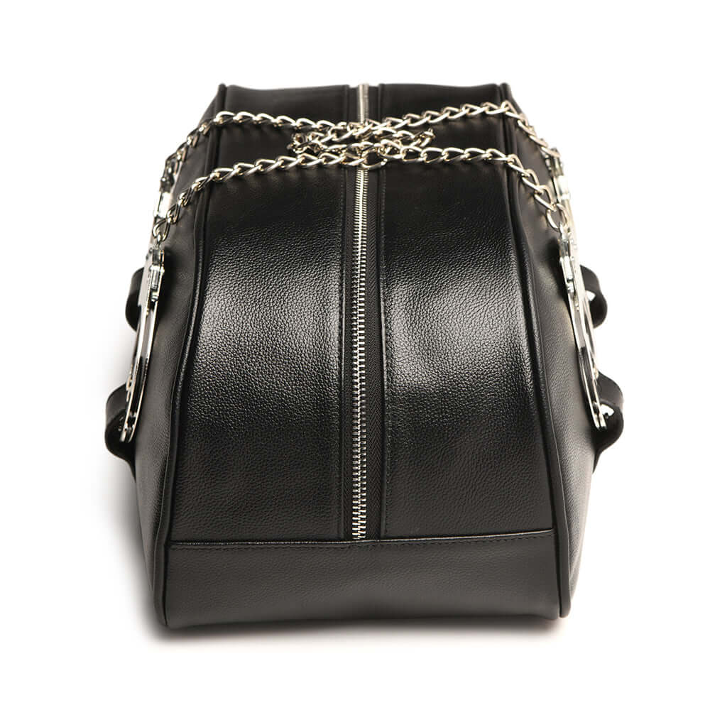 Master Series Cuffed & Loaded Travel Bag in faux leather with handcuff handles and a chain, perfect for bondage essentials.