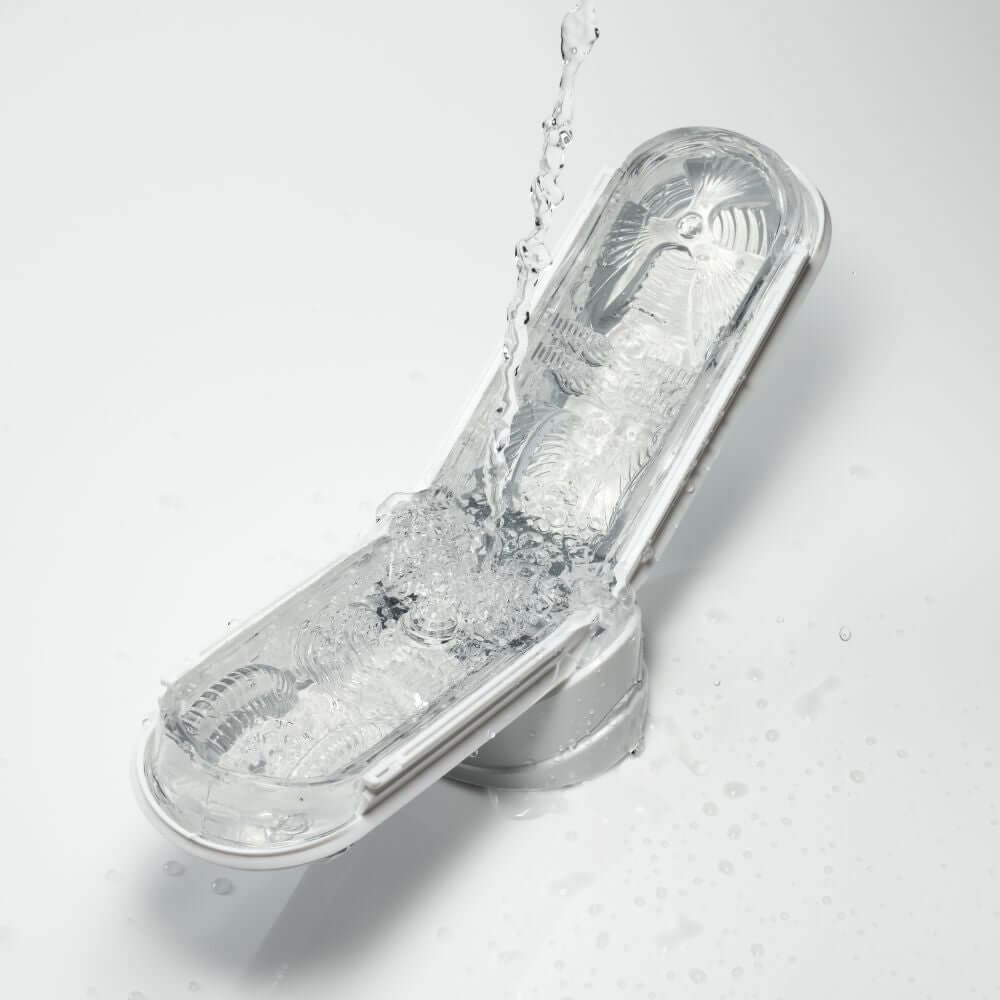 Tenga Flip Zero Gravity White Male Stroker with water splash effect, showcasing its sleek design and premium features.