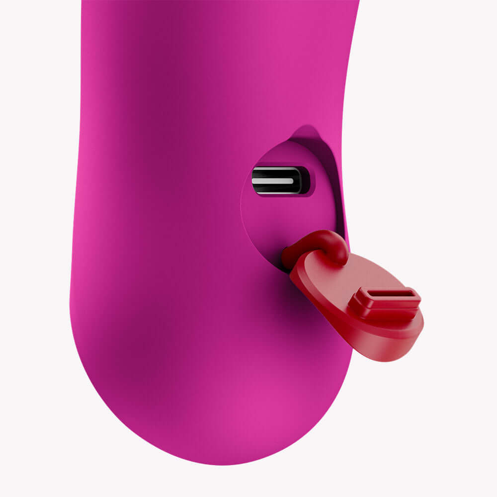 Close-up of the charging port on the Fun Factory Bijou Bullet Vibrator Magenta with a red cap.