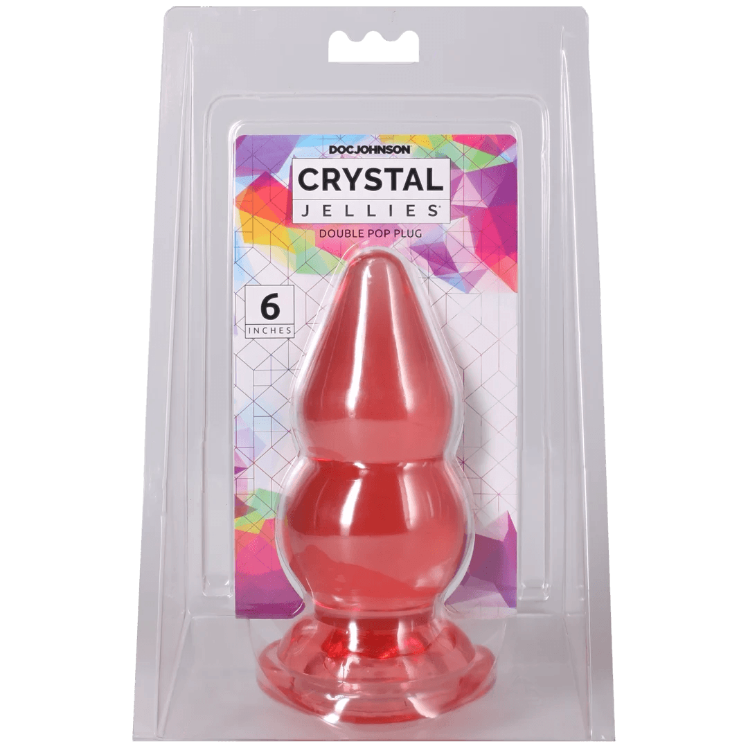 Crystal Jellies Double Pop Plug 6 Inch Pink in packaging showcasing its double curve design.