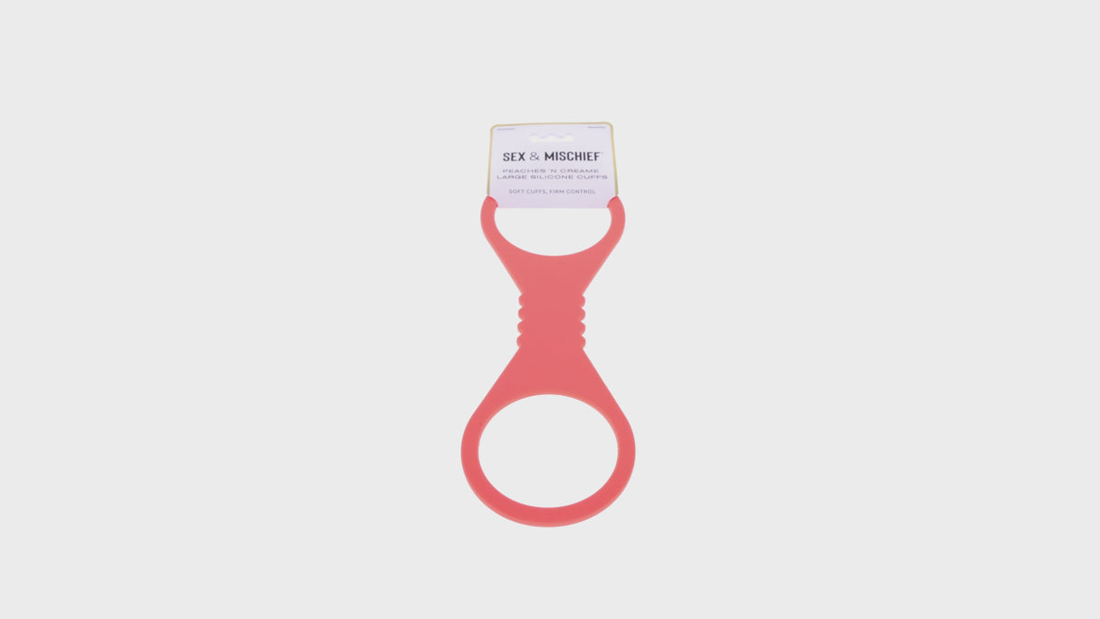 Sportsheets Sex & Mischief Peaches n CreaMe Large Silicone Cuffs in pink silicone material for playful restraint.