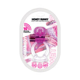 Wet Dreams Dream Boy Honey Bunny Cock and Ball Sling Magenta packaging featuring 10 vibrating frequencies and a vibrant design.