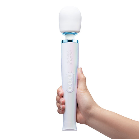 Le Wand Dive Submersible Vibrating Massager Seashell held in hand with ergonomic design and waterproof features.