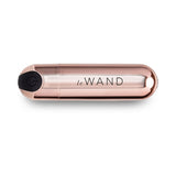 Le Wand Essentials Mini Rose Gold Bullet Vibrator in a sleek design, perfect for targeted stimulation and discreet storage.