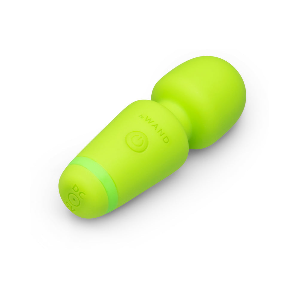 Le Wand Essentials Mini Wand Vibe Pocket-sized Vibrator in vibrant green color, designed for portable pleasure.