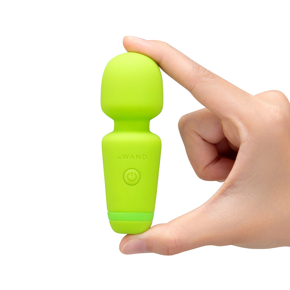 Le Wand Essentials Mini Wand Vibe Pocket-sized Vibrator held in hand, showcasing its compact design.