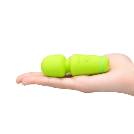 Le Wand Essentials Mini Wand Vibe Pocket-sized Vibrator in a hand showcasing its compact design.