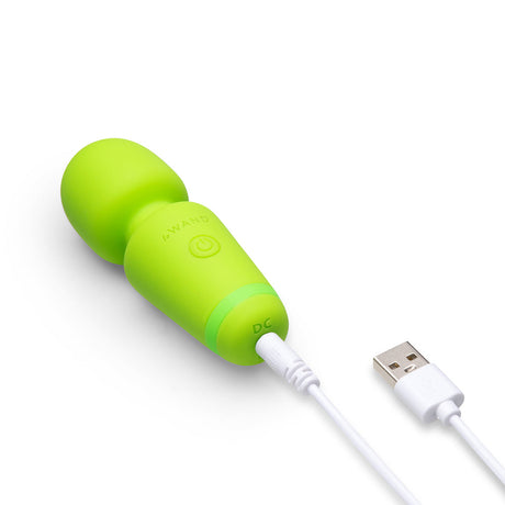 Le Wand Essentials Mini Wand Vibe Pocket-sized Vibrator in vibrant green color with white USB charging cable.