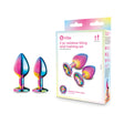 B-vibe Essentials 2-piece Rainbow Bling Anal Training Set displayed with colorful plugs and packaging.