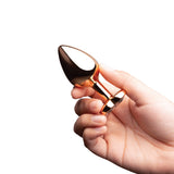 B-vibe Essentials 2-piece Jewel Hearts Anal Training Set held in hand, showcasing stylish heart-shaped jewel base.