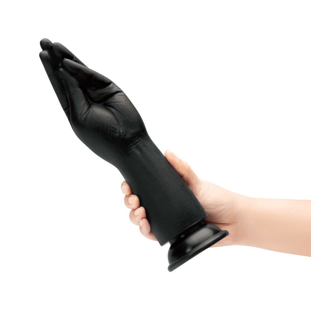 B-vibe Essentials Silicone Hand Fisting Dildo Black held in hand on white background.