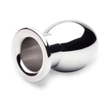 B-vibe Essentials 3 Inch Aluminum Hollow Tunnel Butt Plug featuring a sleek, shiny design for anal play.