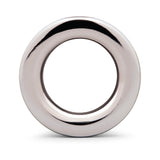 B-vibe Essentials 3 Inch Aluminum Hollow Tunnel Butt Plug with a sleek, shiny finish and hollow center.