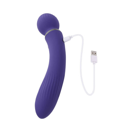 Evolved Shiver Silicone Rechargeable Vibrator Purple charging with USB cable.