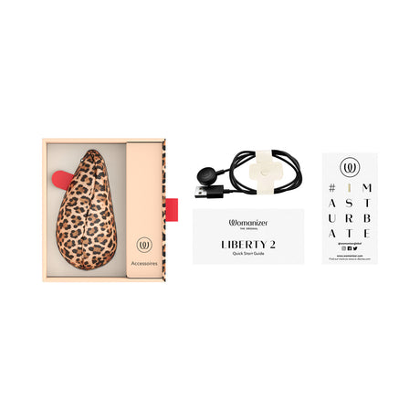 Womanizer Liberty 2 Leopard Air Pulse Clitoral Stimulator packaging and accessories laid out.
