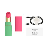 Womanizer Beauty Clitoral Stimulator Green Pink with charging cable and quick start guide.