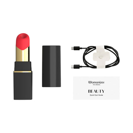Womanizer Beauty Air Pulse Stimulator Black & Gold image with quick start guide and charger