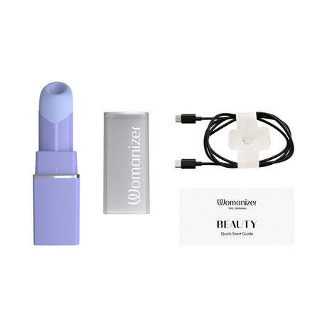 Womanizer Beauty Lilac Clitoral Air Pulse Stimulator with charging cable and quick start guide, elegantly designed in lilac.