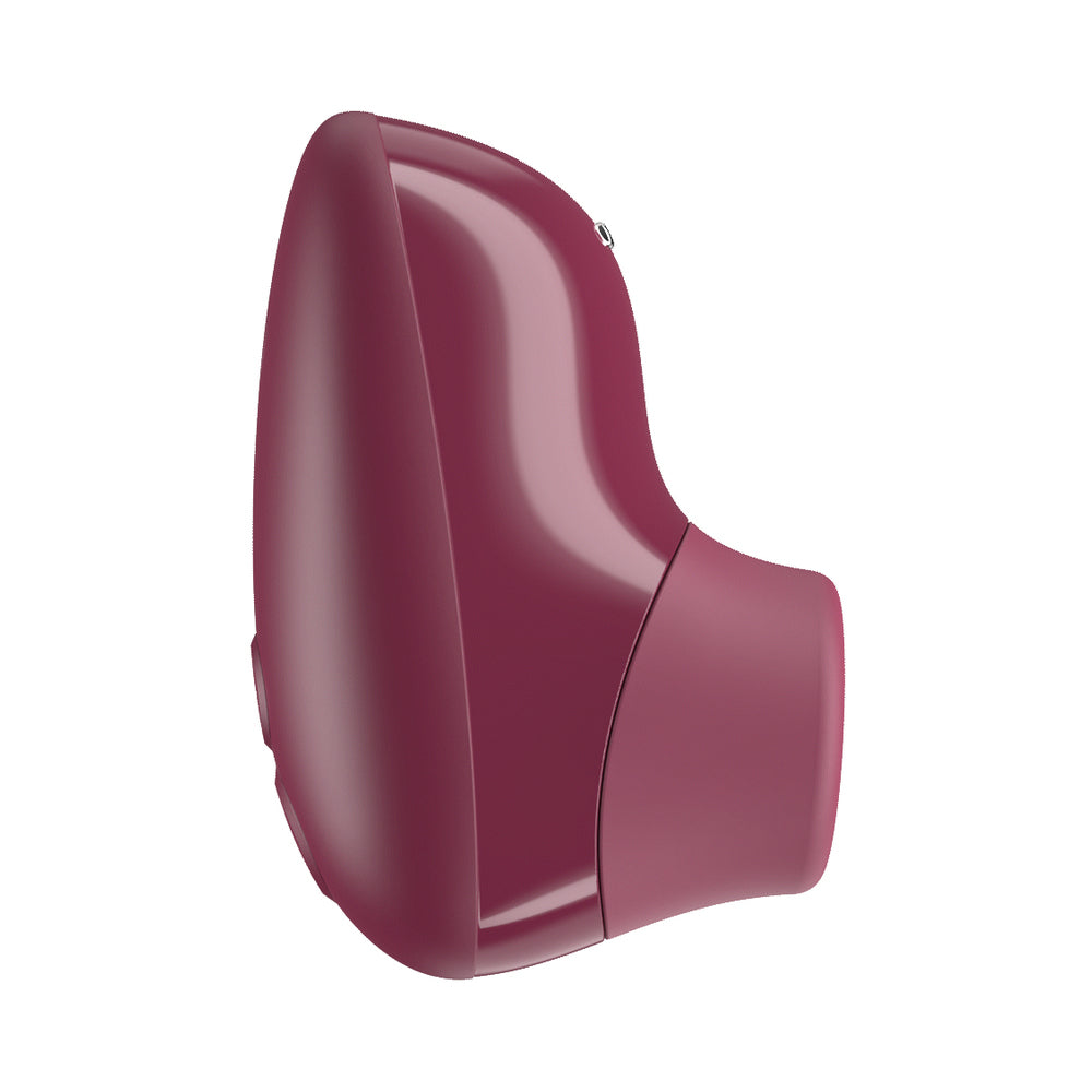 Womanizer Snap Clitoral Stimulator Crushed Berry in a sleek berry design for compact pleasure.