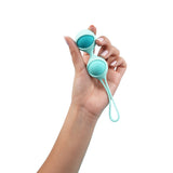 UVA Kegel Balls Set With 3 Progressive Weights held in a hand, showcasing ergonomic design and body-safe silicone.