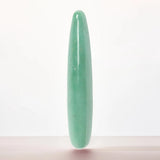 Chakrubs Indian Jade Slim Stone Dildo with a smooth green surface ideal for sensual and self-care experiences.