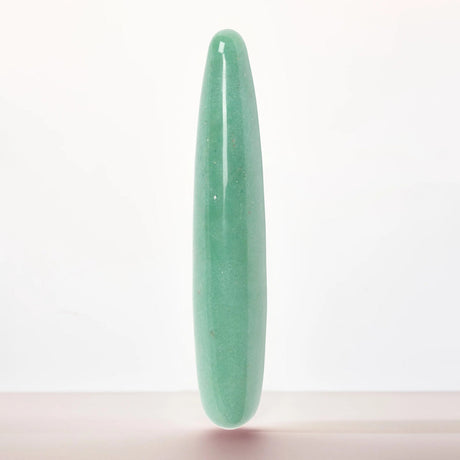 Chakrubs Indian Jade Slim Stone Dildo with a smooth green surface ideal for sensual and self-care experiences.