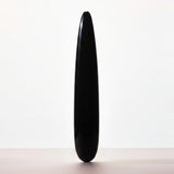 Chakrubs Xaga Slim Non-Phallic Dildo displayed against a minimalist background, emphasizing its sleek design.