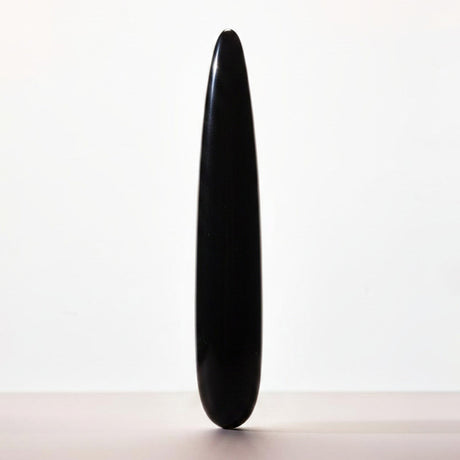Chakrubs Xaga Slim Non-Phallic Dildo displayed against a minimalist background, emphasizing its sleek design.