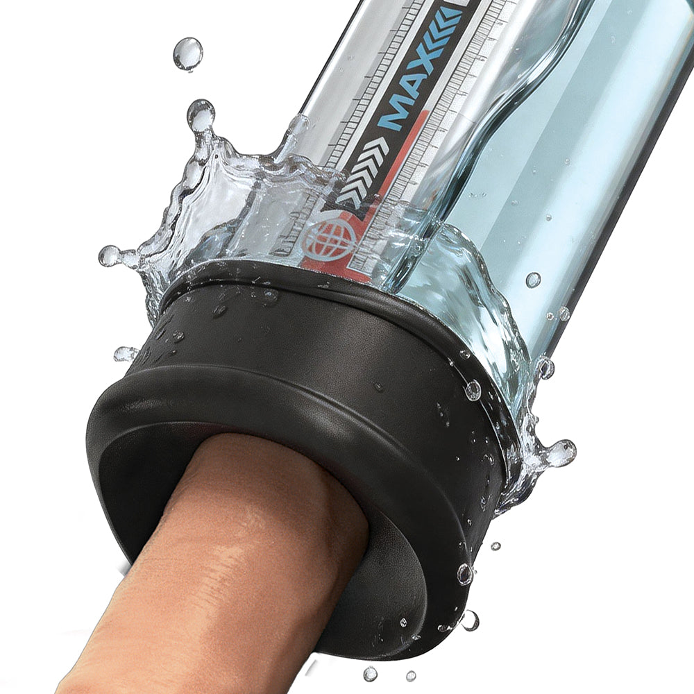 Pumpworx Maxboost Pro Flow Deluxe Penis Pump Kit Black in use with water splashing around the device.