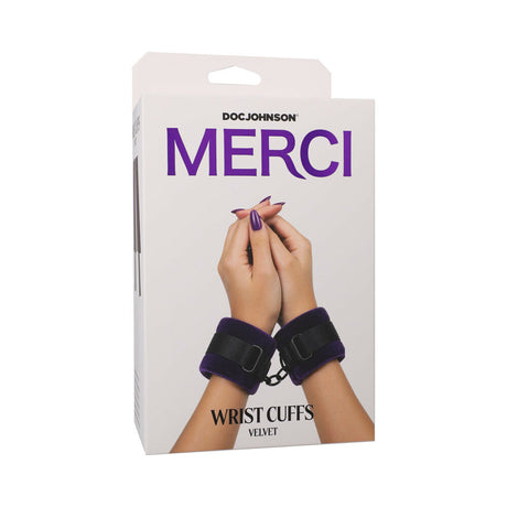 Merci Velvet Wrist Cuffs Violet Black packaging by Doc Johnson featuring hands with velvet cuffs.