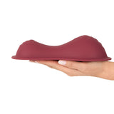 Vibepad Intense 2 Grinding Pad Vibrator with Remote displayed in hand, showcasing its ergonomic design for pleasure.