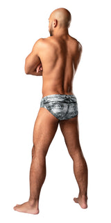 Model wearing Male Power Dirty Denim Bikini Medium Denim, showcasing the back view with faux denim print.