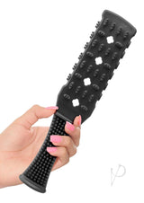 Fetish Fantasy Series Rubber Paddle 10.5 inch Black in hand, showcasing its unique design for impact play.