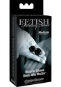Fetish Fantasy Glass Ben-Wa Ball 1.25 inch Black packaging with two glass Ben-Wa balls displayed in hand.