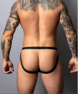 Male Power Hot Mesh Jock Black L/XL displayed on a tattooed model from behind, showcasing sleek design and comfort.