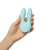 Love To Love Hear Me Enjoy-mint Clitoral Vibrator held in hand, featuring dual motors and heart-shaped silicone ears.
