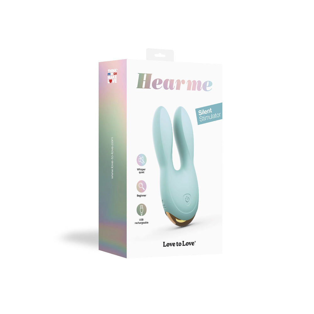 Love To Love Hear Me Enjoy-mint Clitoral Vibrator packaging on display with heart-shaped silicone ears.