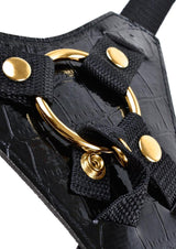 Fetish Fantasy Gold Designer Strap-On 7 inch Black Gold close-up of harness with metallic O-ring and black straps.