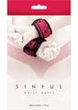 Sinful Adjustable Faux Leather Wrist Cuffs Pink packaging featuring adjustable cuffs on a white background.